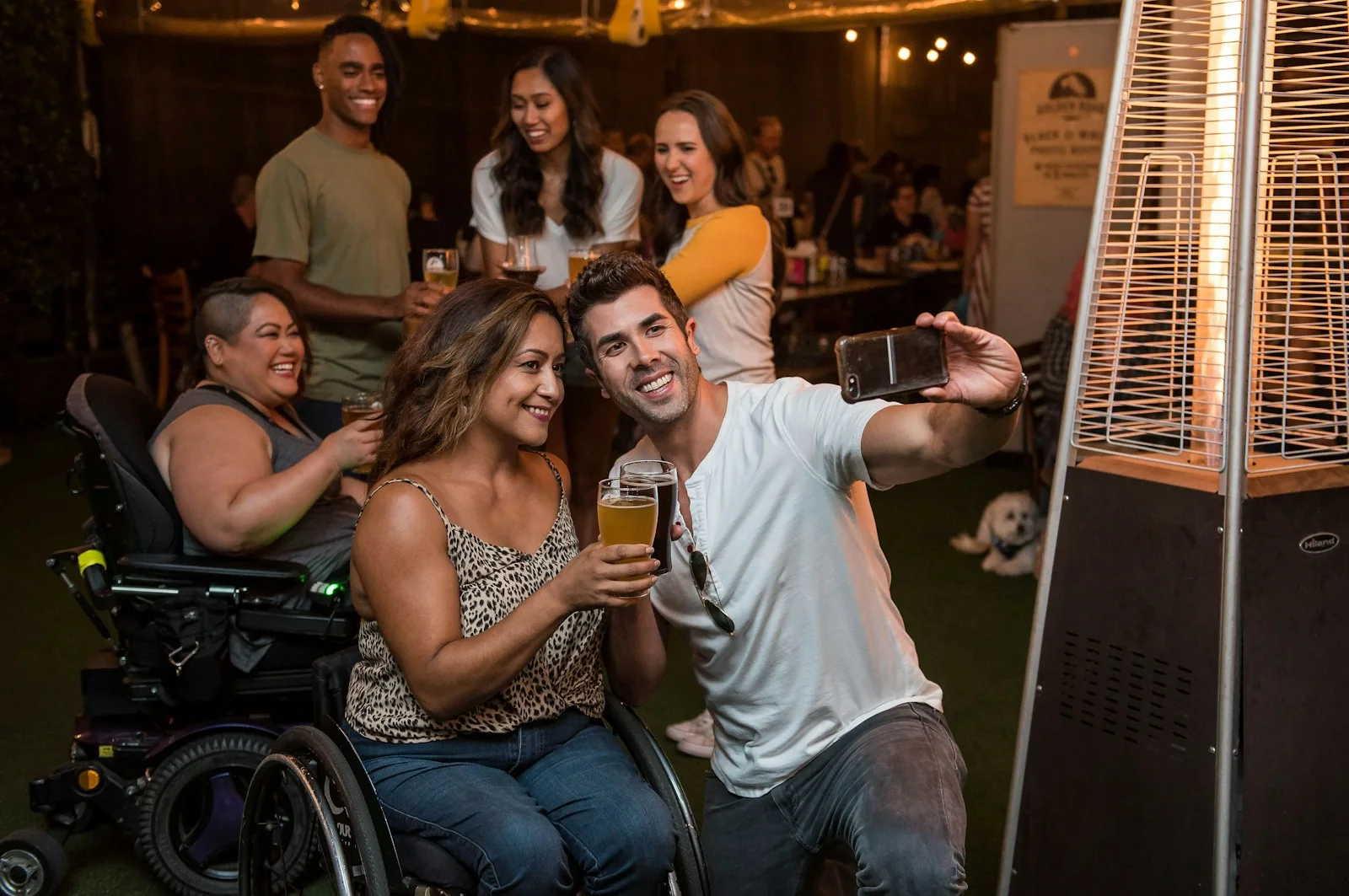 People enjoying drinks at an outdoor evening gathering
